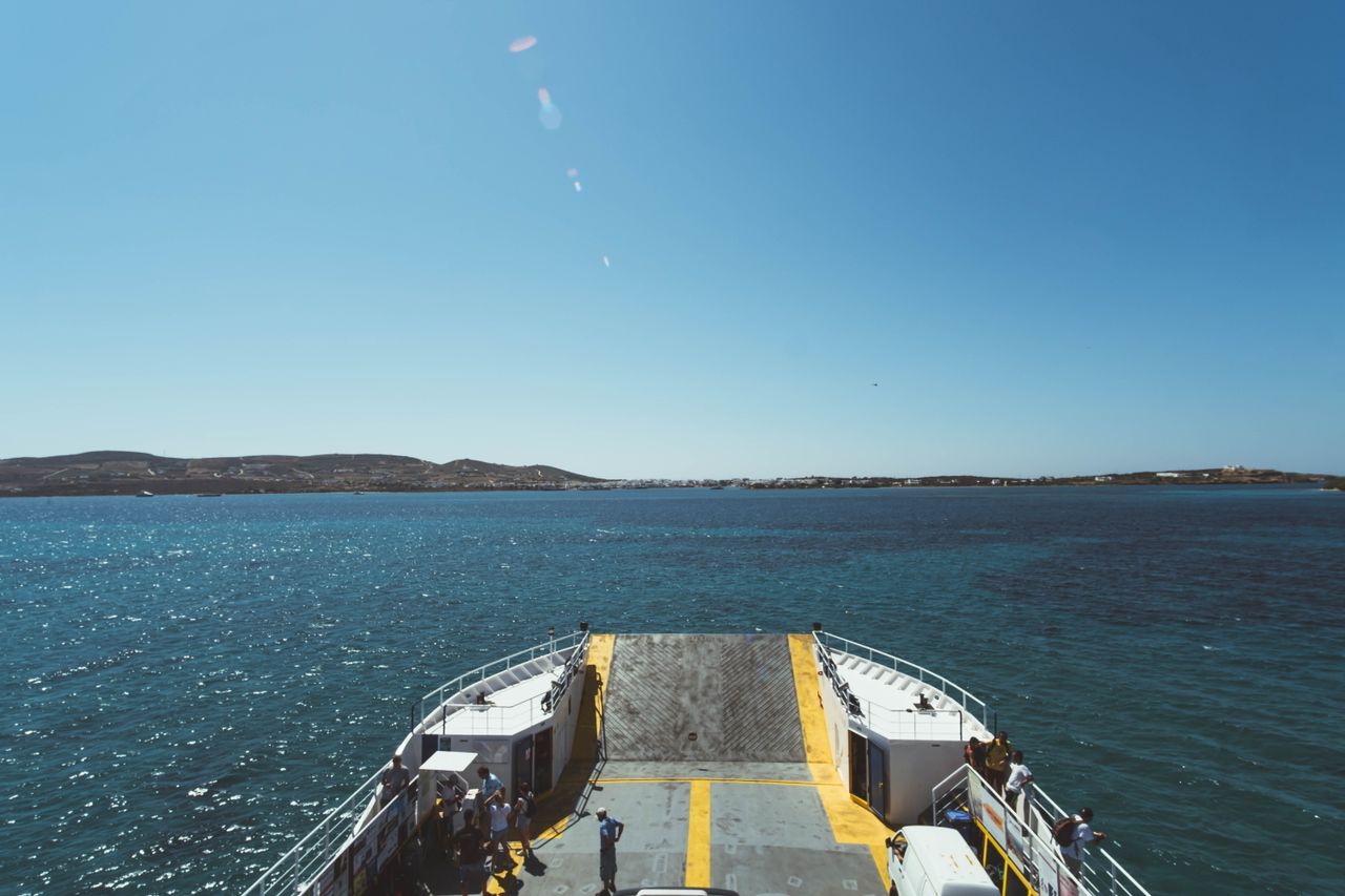 A ferry crossing the blue Aegean Sea between the Cyclades islands