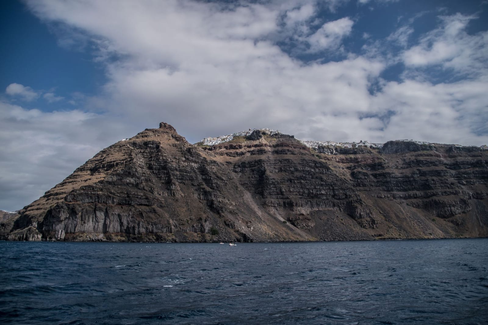 Skaros Rock and the caldera cliffs below Imerovigli, Santorini, seen from the sea